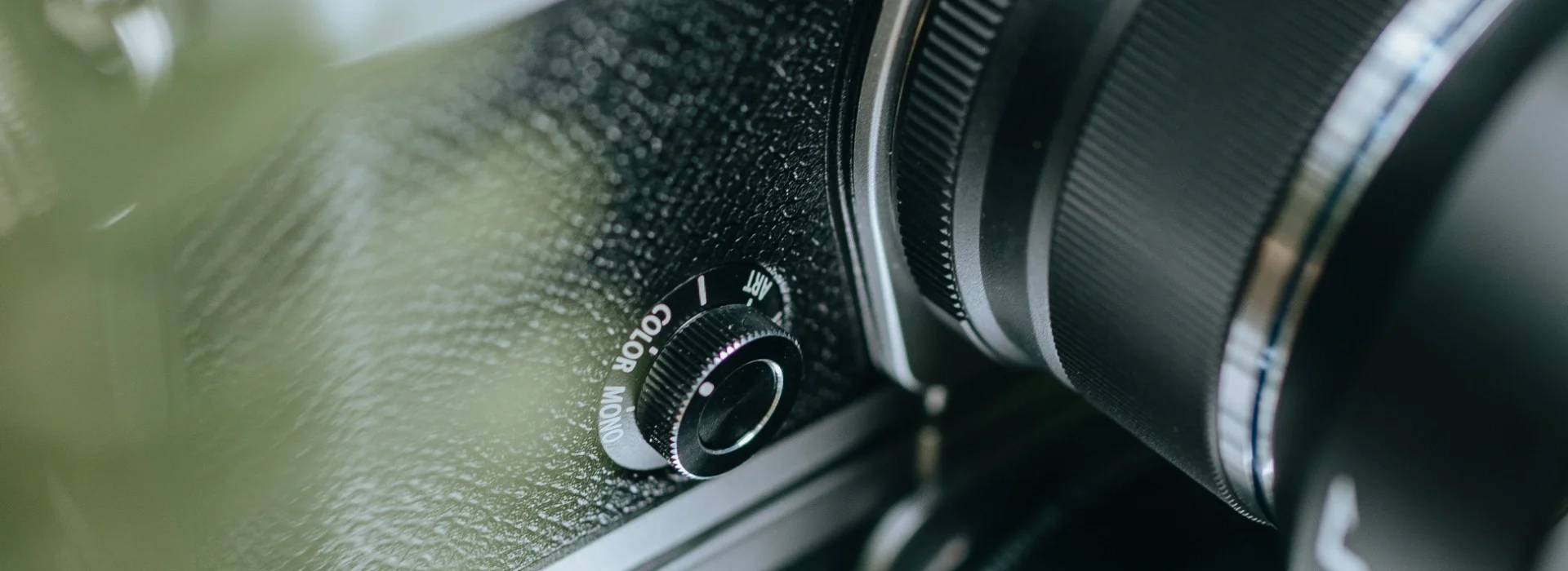 Close up photo of the OM System OM-3's creative dial.